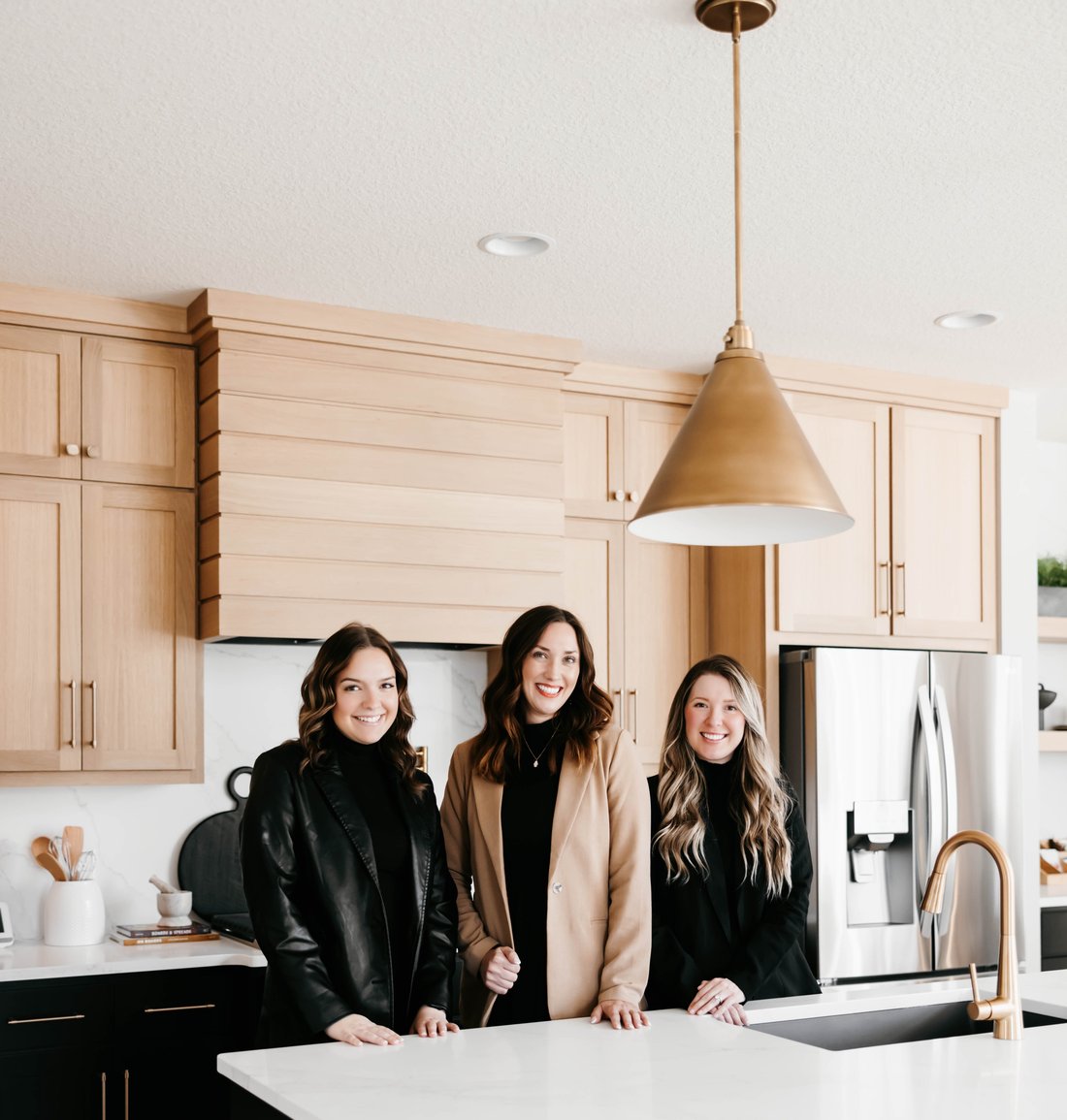 Mercedes with Molly and Mikaela, the Oliver White Mortgage Group marketing team